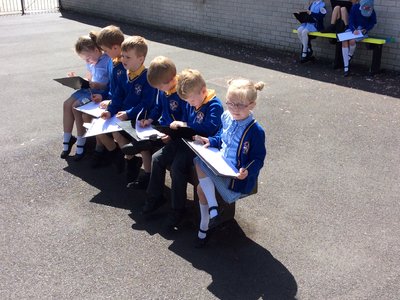 Image of Year 1 working outside in the sun
